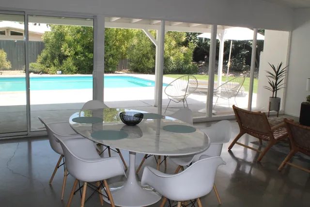 a view of a dining room with furniture window and outside view