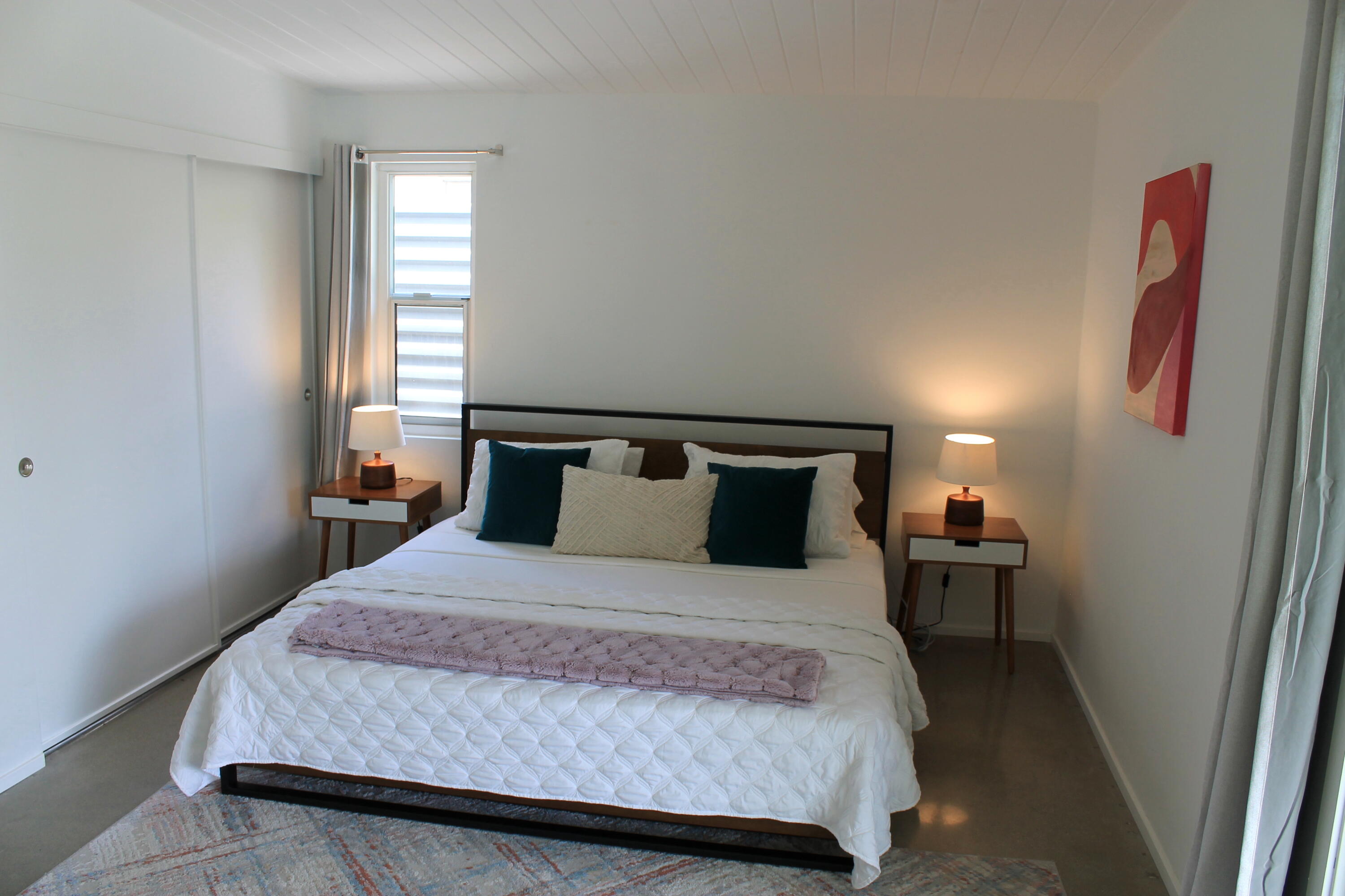 278 North Sunset Way Palm Springs, CA 92262 - Photo 8 of 14 a bedroom with a bed and wooden floor