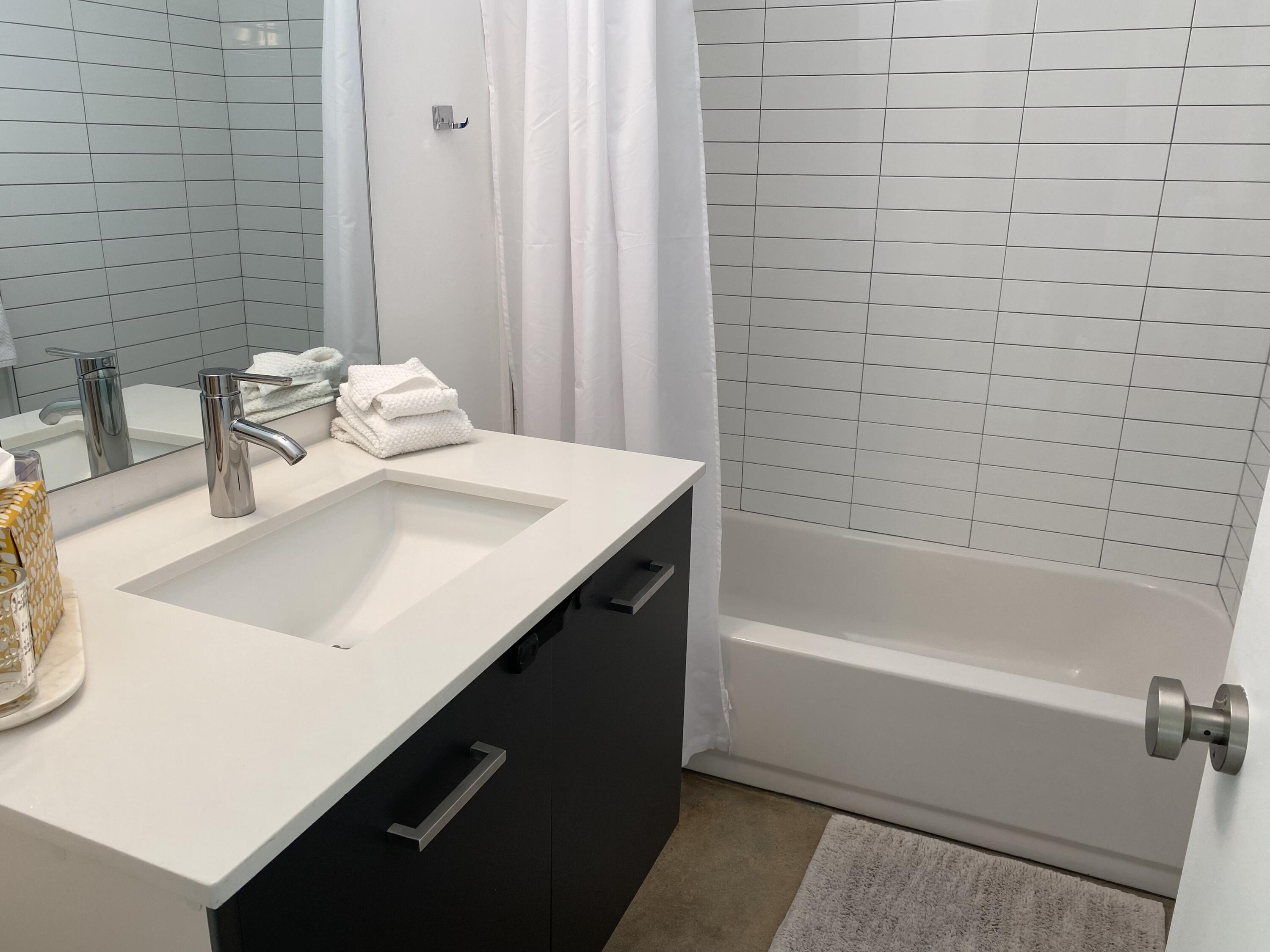 278 North Sunset Way Palm Springs, CA 92262 - Photo 9 of 14 a bathroom with a sink a bathtub and a shower