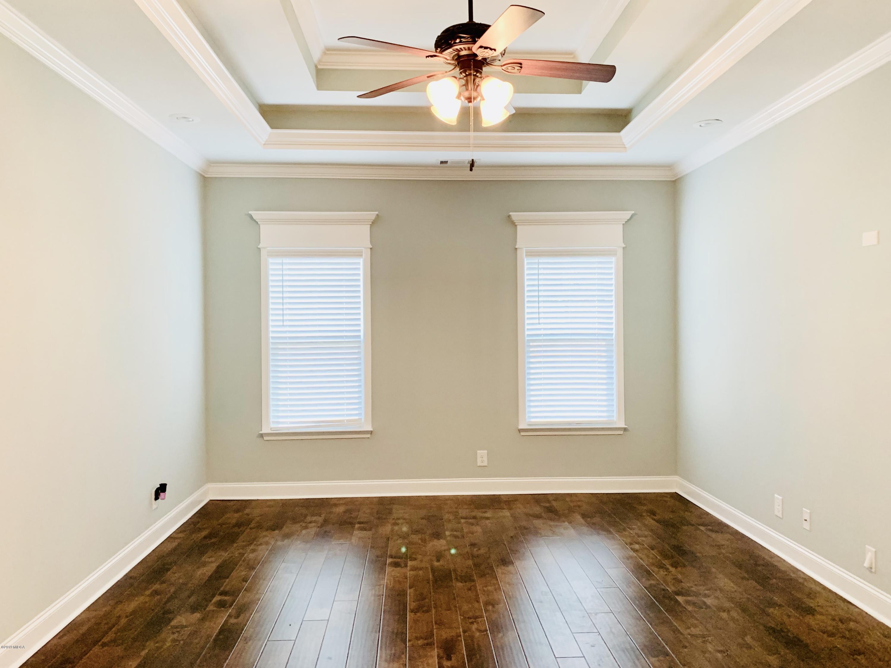 208 Bridgehampton Way Perry, GA 31069 - Photo 14 of 37 an empty room with a window and wooden floor