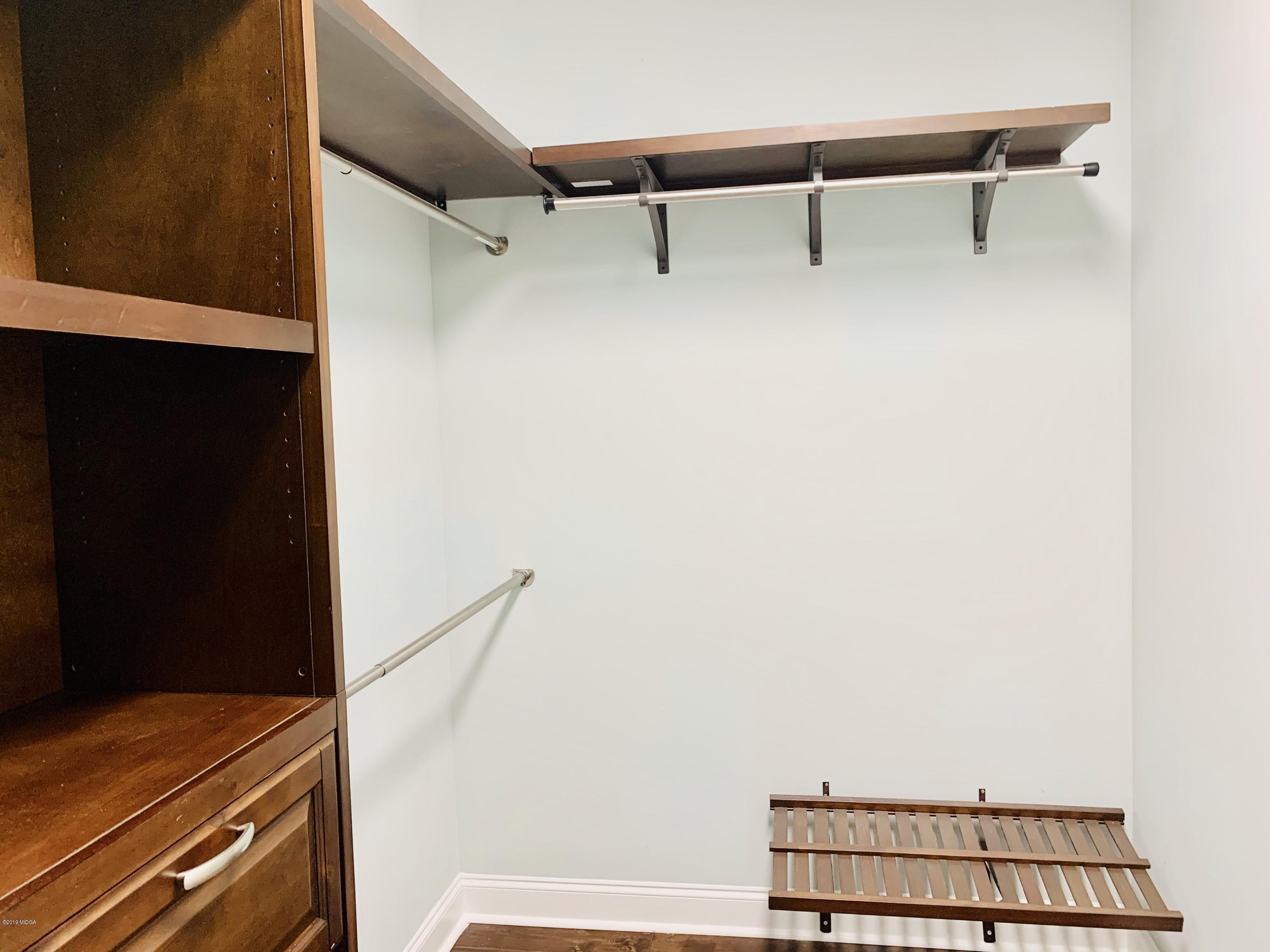 208 Bridgehampton Way Perry, GA 31069 - Photo 22 of 37 a view of a room with racks on the wall