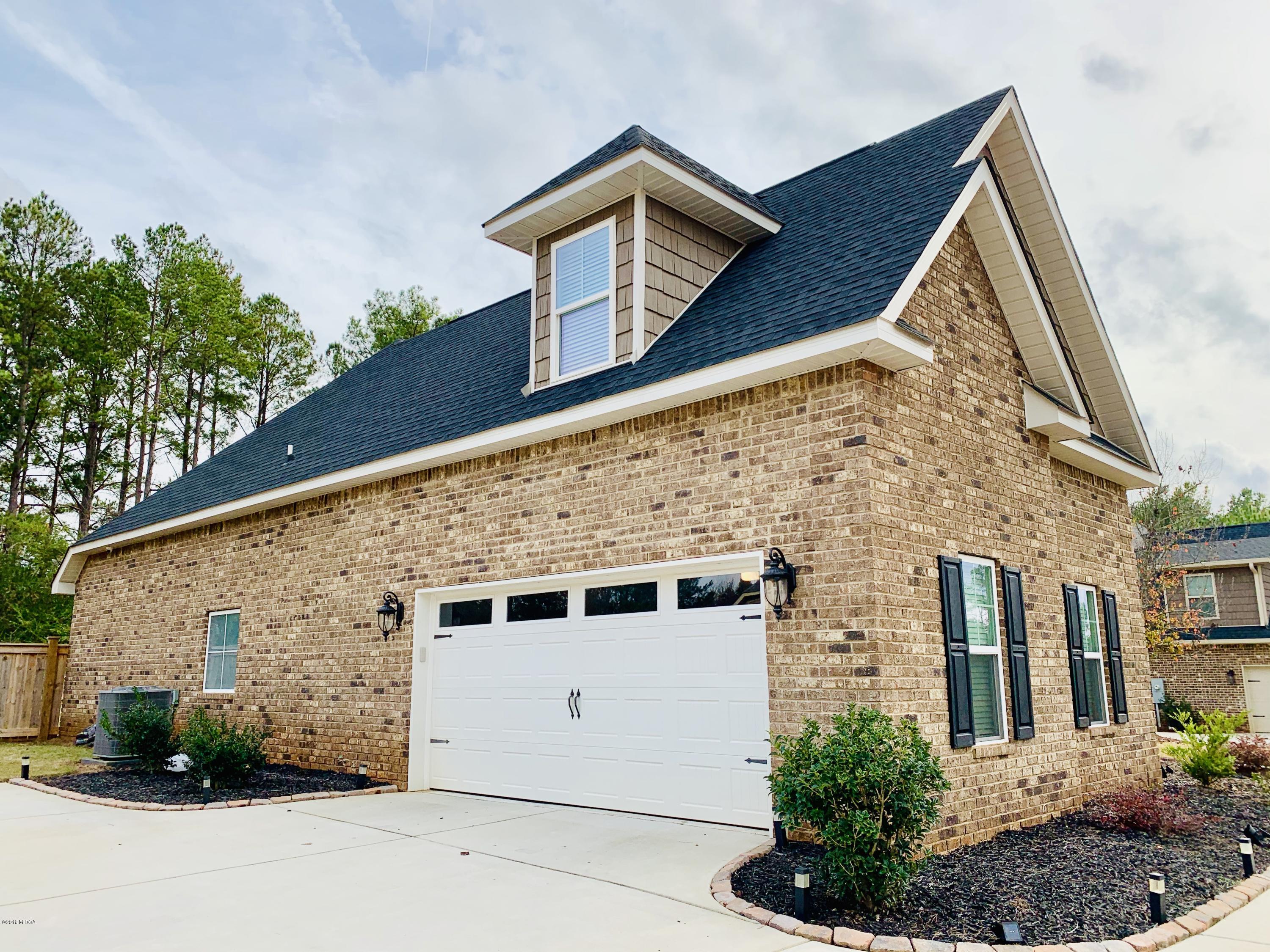 208 Bridgehampton Way Perry, GA 31069 - Photo 36 of 37 a view of a house with a yard