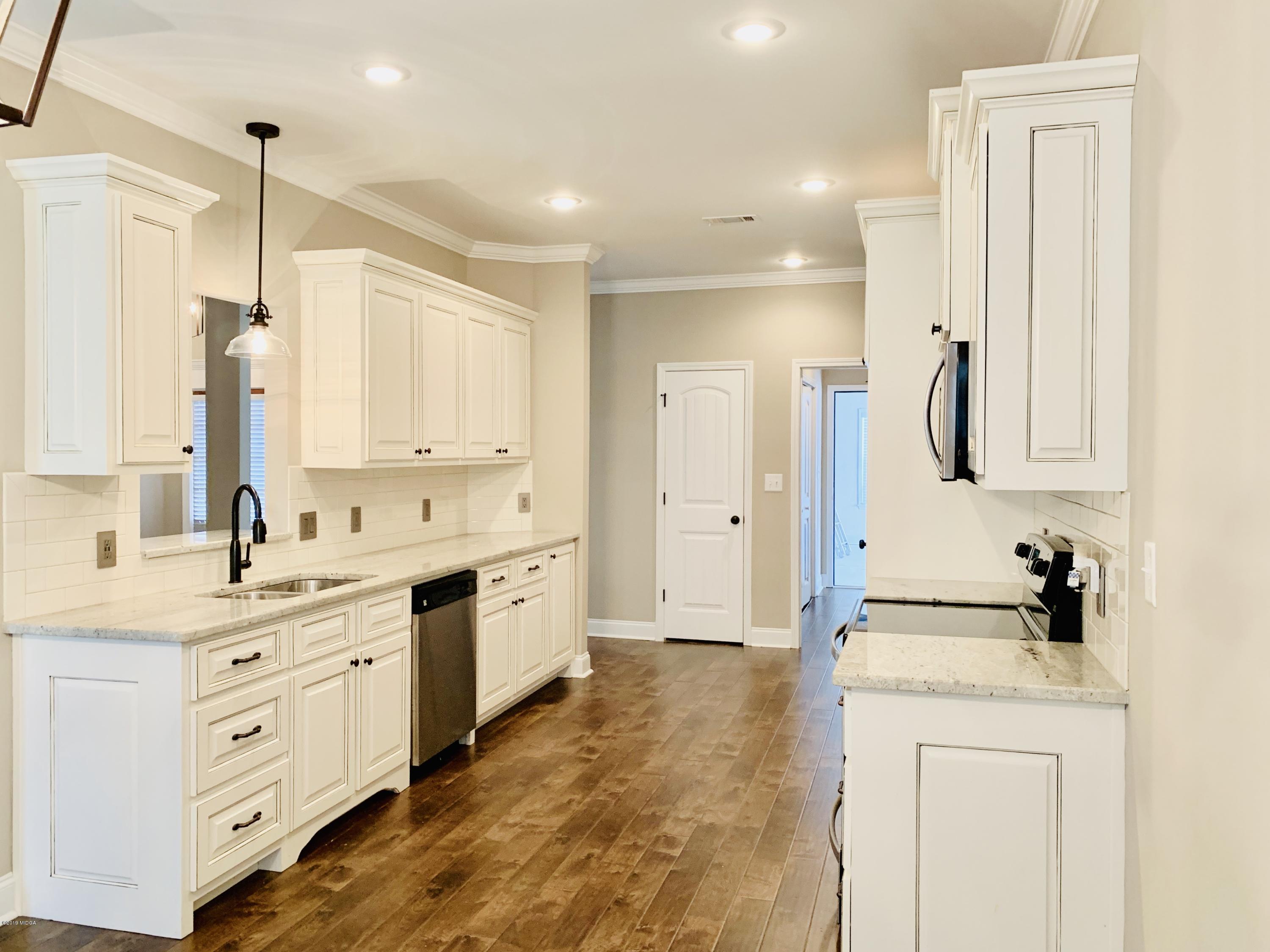 208 Bridgehampton Way Perry, GA 31069 - Photo 7 of 37 a spacious bathroom with a double vanity sink mirror and double