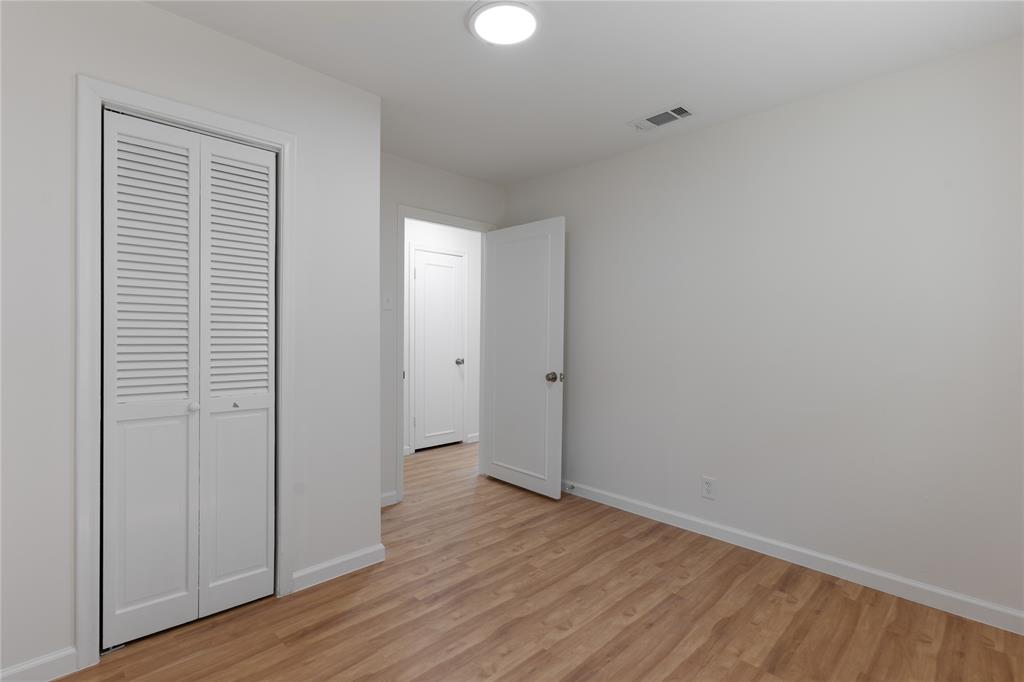 9225 Plano Road Dallas, TX 75238 - Photo 17 of 24 wooden floor in an empty room