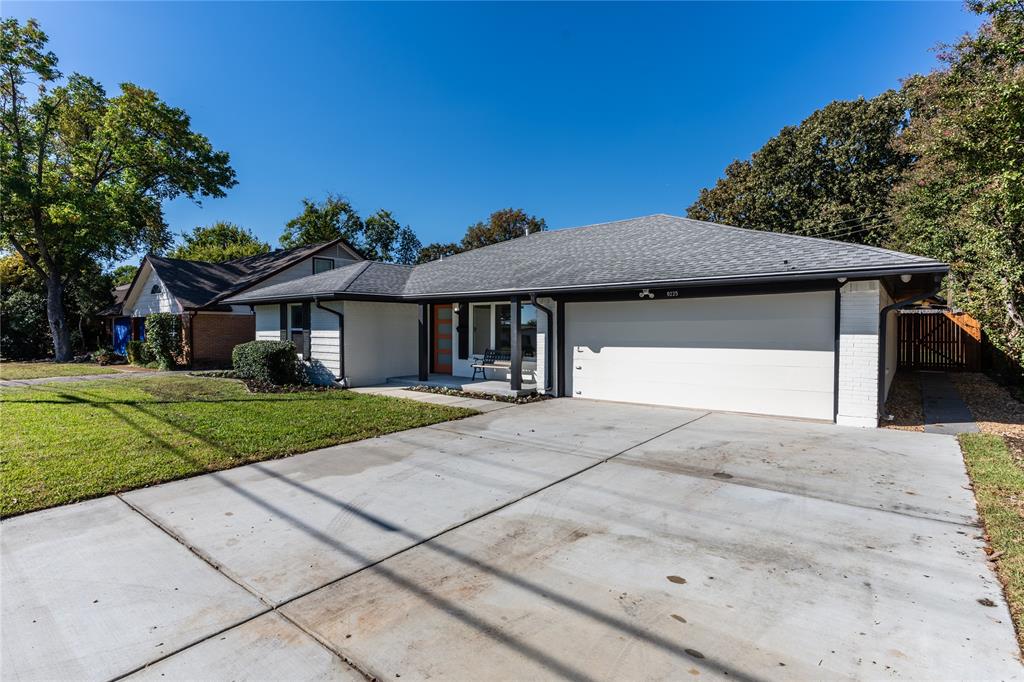 9225 Plano Road Dallas, TX 75238 - Photo 2 of 24 a front view of a house with a yard
