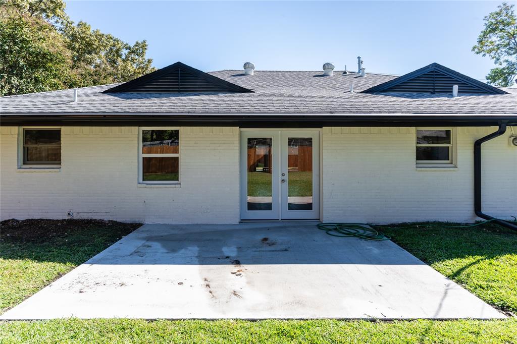9225 Plano Road Dallas, TX 75238 - Photo 22 of 24 a front view of a house with a yard