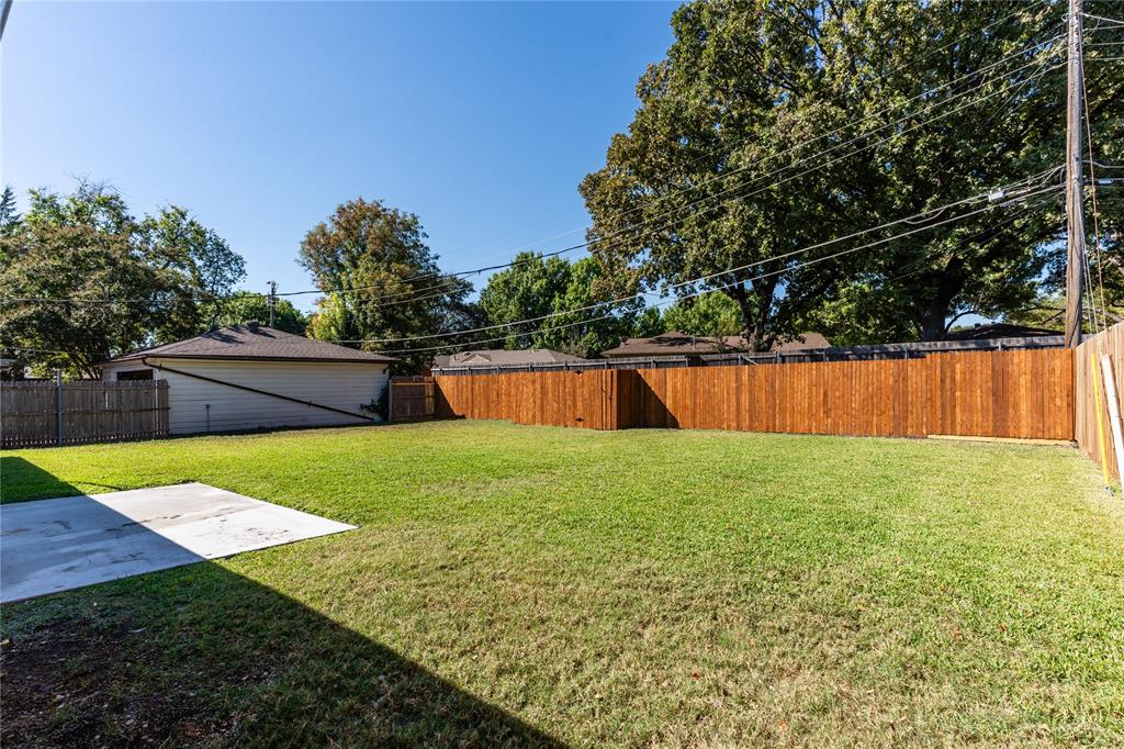 9225 Plano Road Dallas, TX 75238 - Photo 23 of 24 a view of a backyard with a garden and trees