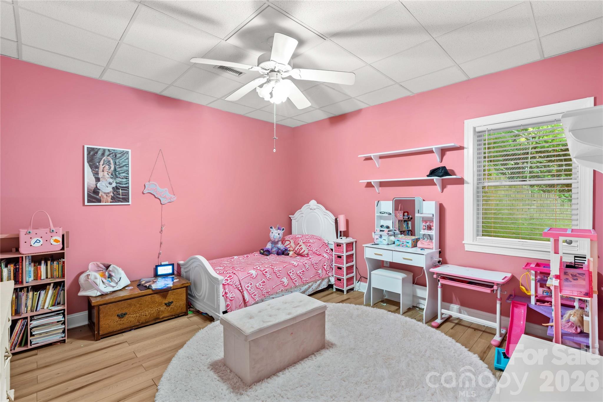 711 Spring Pointe Drive Stony Point, NC 28678 - Photo 25 of 47 a bedroom with a bed and a chandelier