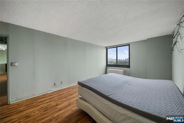 a bedroom with a bed and window