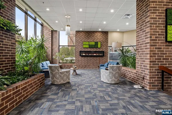 a room with furniture and potted plants