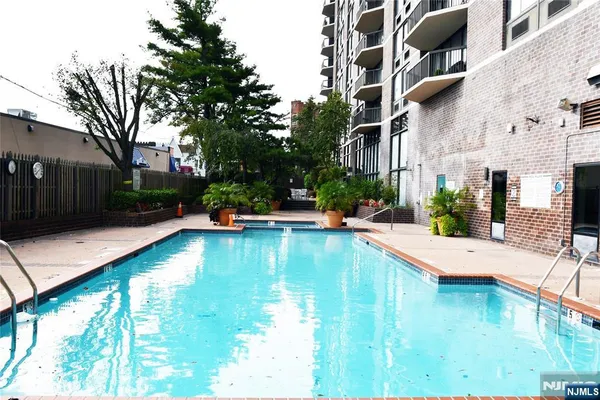 a view of a patio with swimming pool