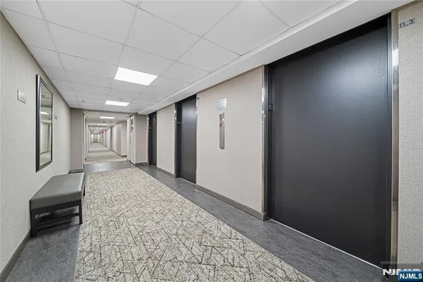 a hallway with sliding door and couch