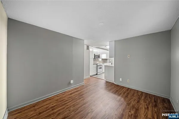 a view of a kitchen with wooden floor
