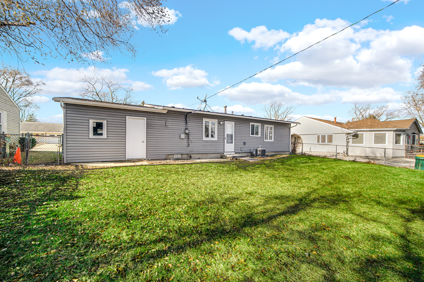 407 Dalhart Avenue Romeoville, IL 60446 - Photo 16 of 17 a view of a house with a backyard