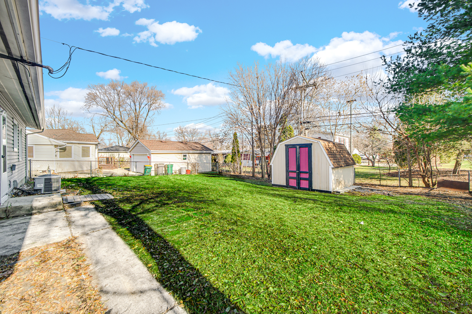 407 Dalhart Avenue Romeoville, IL 60446 - Photo 17 of 17 a view of a house with a yard
