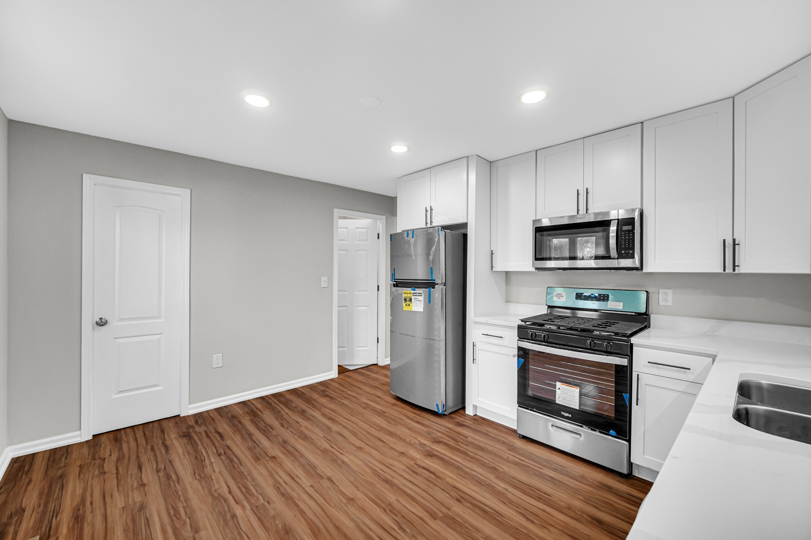 407 Dalhart Avenue Romeoville, IL 60446 - Photo 4 of 17 a kitchen with a refrigerator and a stove top oven