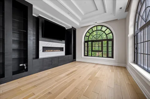 a view of an empty room with glass door