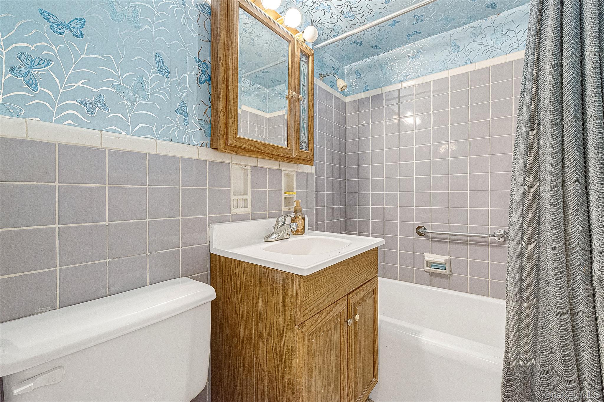 97-37 63rd Road, Unit 2/B Queens, NY 11374 - Photo 17 of 26 a bathroom with a sink a toilet and shower