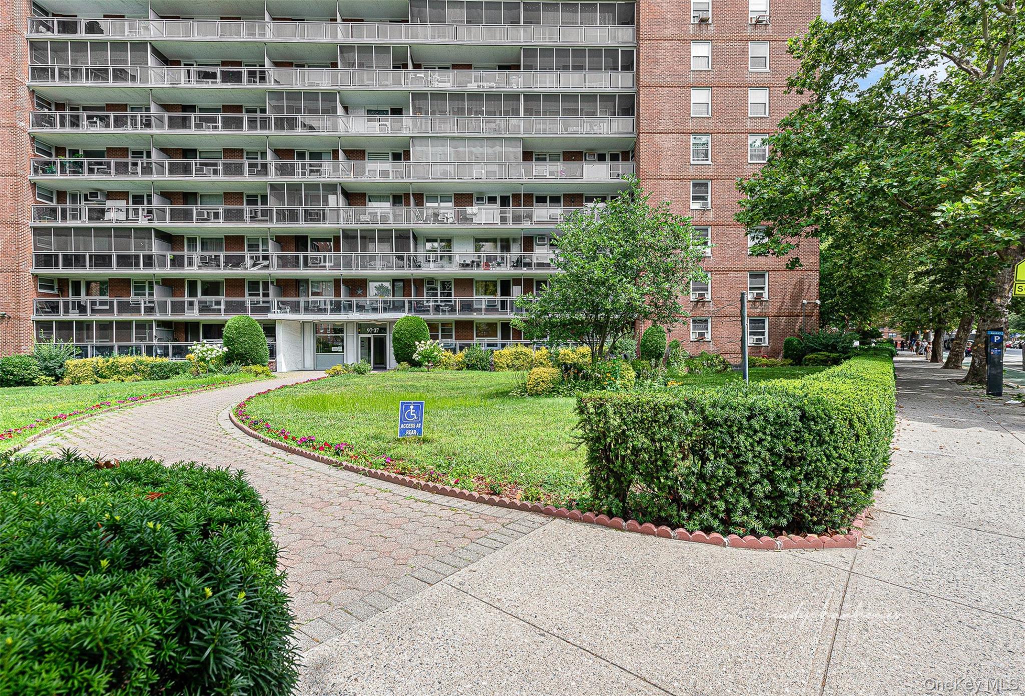97-37 63rd Road, Unit 2/B Queens, NY 11374 - Photo 2 of 26 a view of a building with a garden