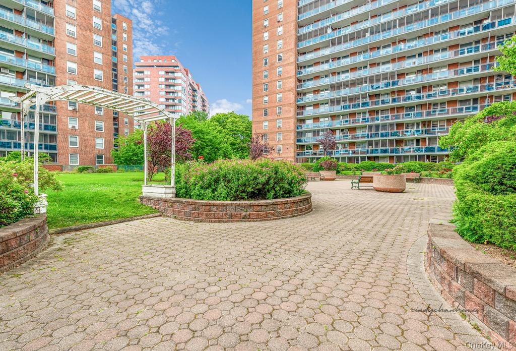 97-37 63rd Road, Unit 2/B Queens, NY 11374 - Photo 23 of 26 a view of building with yard