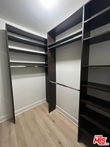 a view of an empty walk in closet