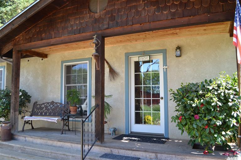 2091 Riggs Road Lakeport, CA 95453 - Photo 1 of 1 a view of a porch with furniture and garden