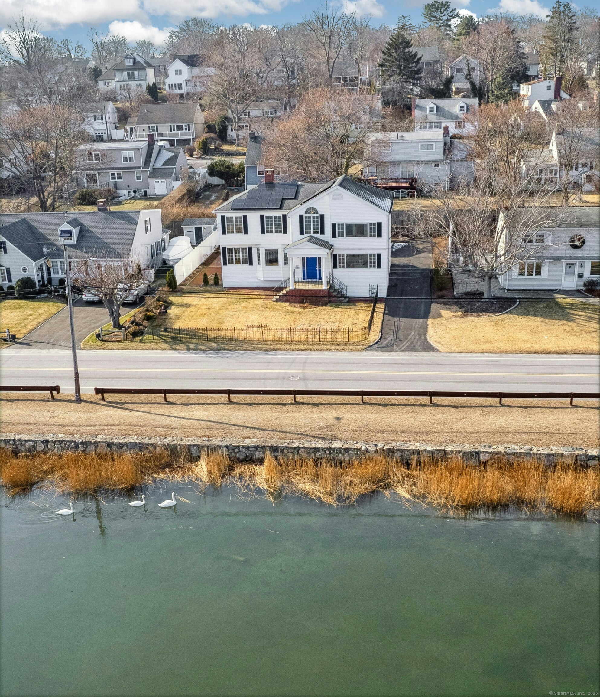 237 Weed Avenue Stamford, CT 06902 - Photo 1 of 1 a view of residential houses with outdoor space and swimming pool