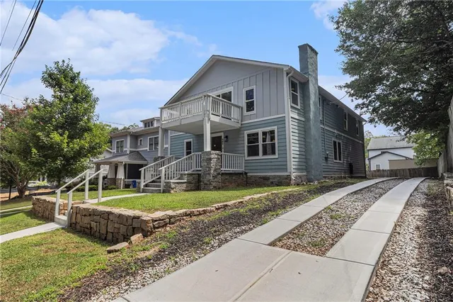 a front view of a house with garden