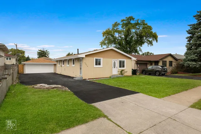 a view of a yard in front of a house with a small yard