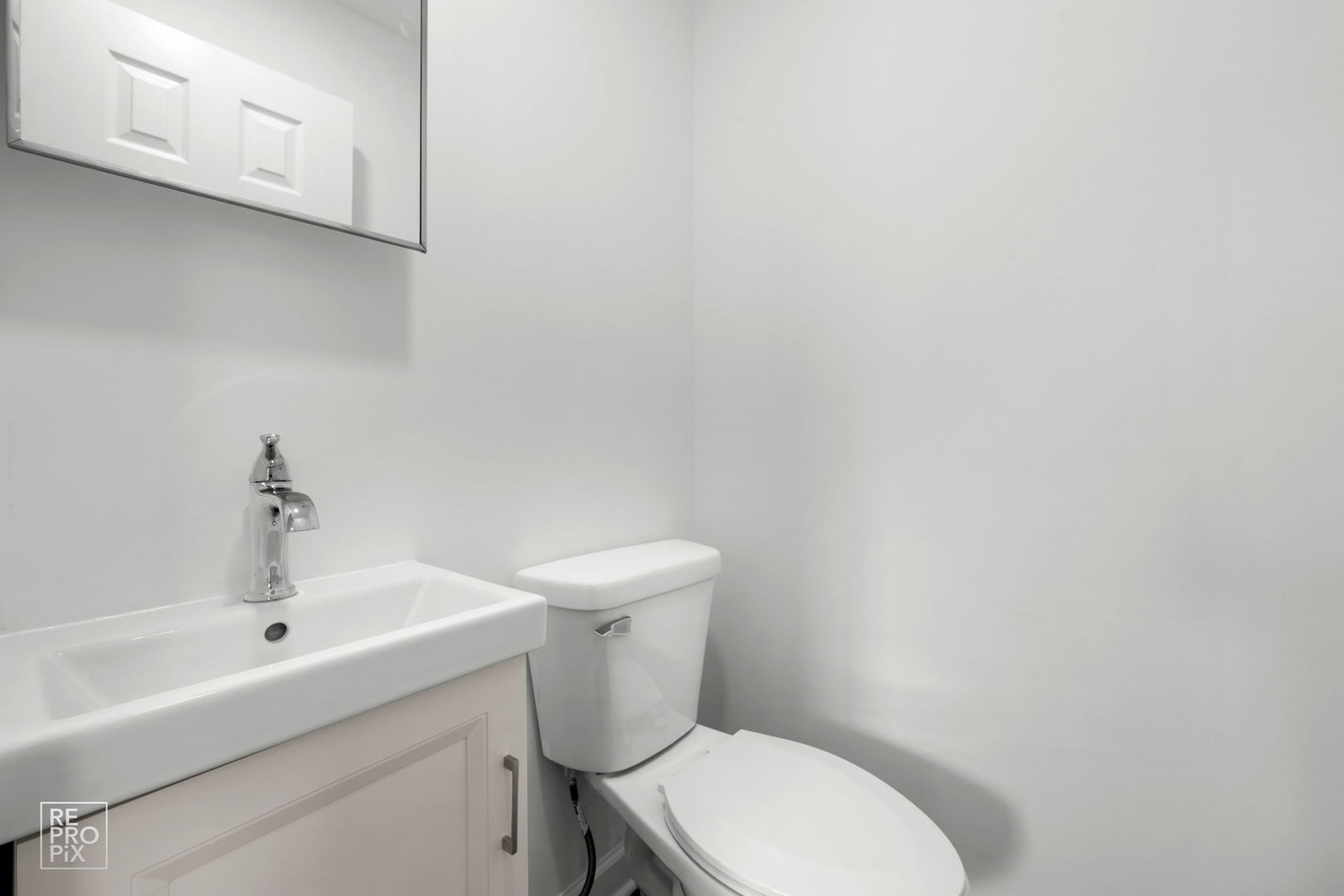 7616 South 78th Avenue Bridgeview, IL 60455 - Photo 5 of 10 a white toilet sitting next to a white sink