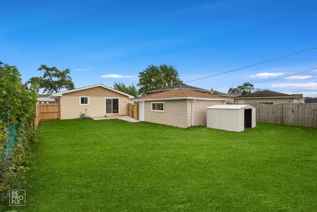 a view of a backyard of the house