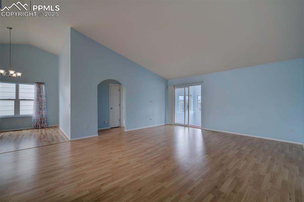 8072 Oliver Road Peyton, CO 80831 - Photo 13 of 30 a view of an empty room with window and wooden floor