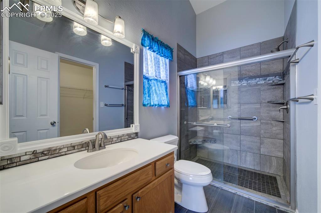 8072 Oliver Road Peyton, CO 80831 - Photo 19 of 30 a bathroom with a sink toilet and shower