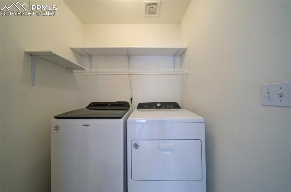 8072 Oliver Road Peyton, CO 80831 - Photo 23 of 30 a utility room with dryer and washer