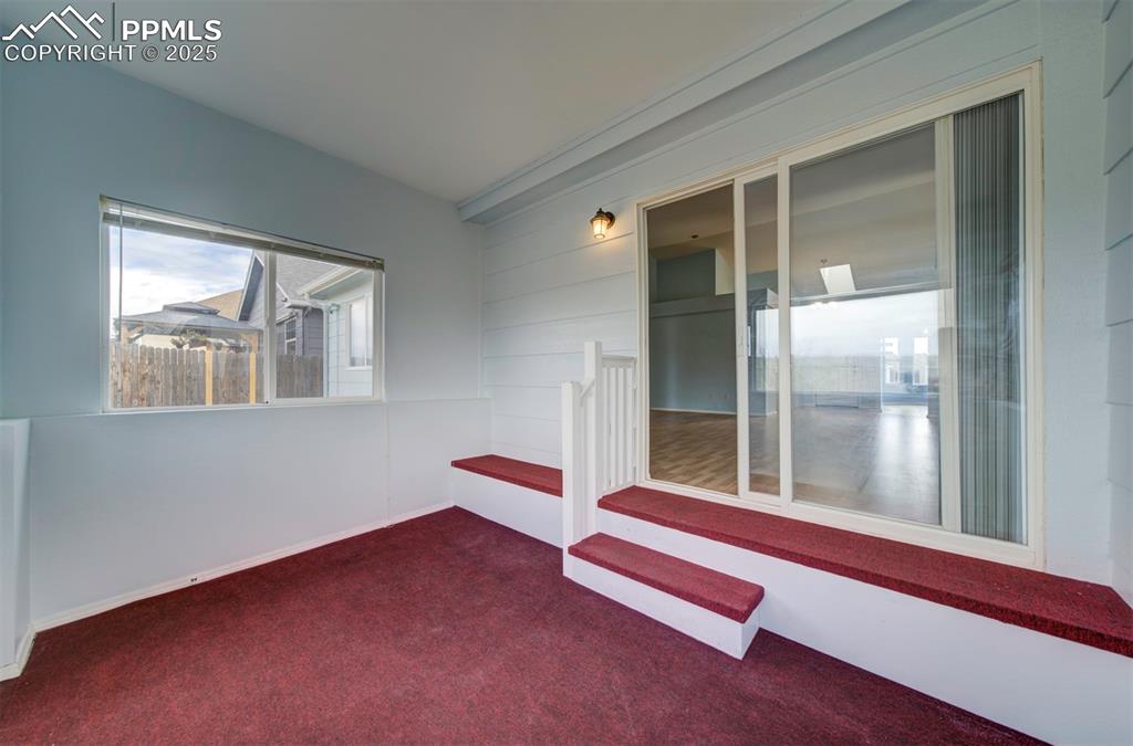 8072 Oliver Road Peyton, CO 80831 - Photo 24 of 30 a wooden bench sitting in front of a window