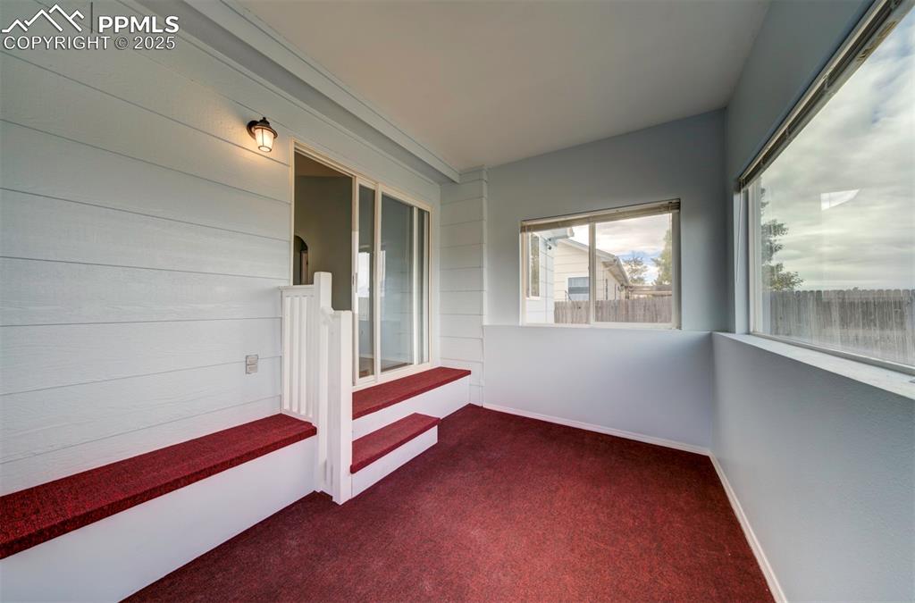 8072 Oliver Road Peyton, CO 80831 - Photo 25 of 30 a view of empty room with wooden floor and fan