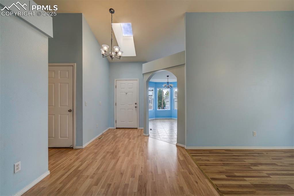 8072 Oliver Road Peyton, CO 80831 - Photo 4 of 30 wooden floor in an empty room with a mirror
