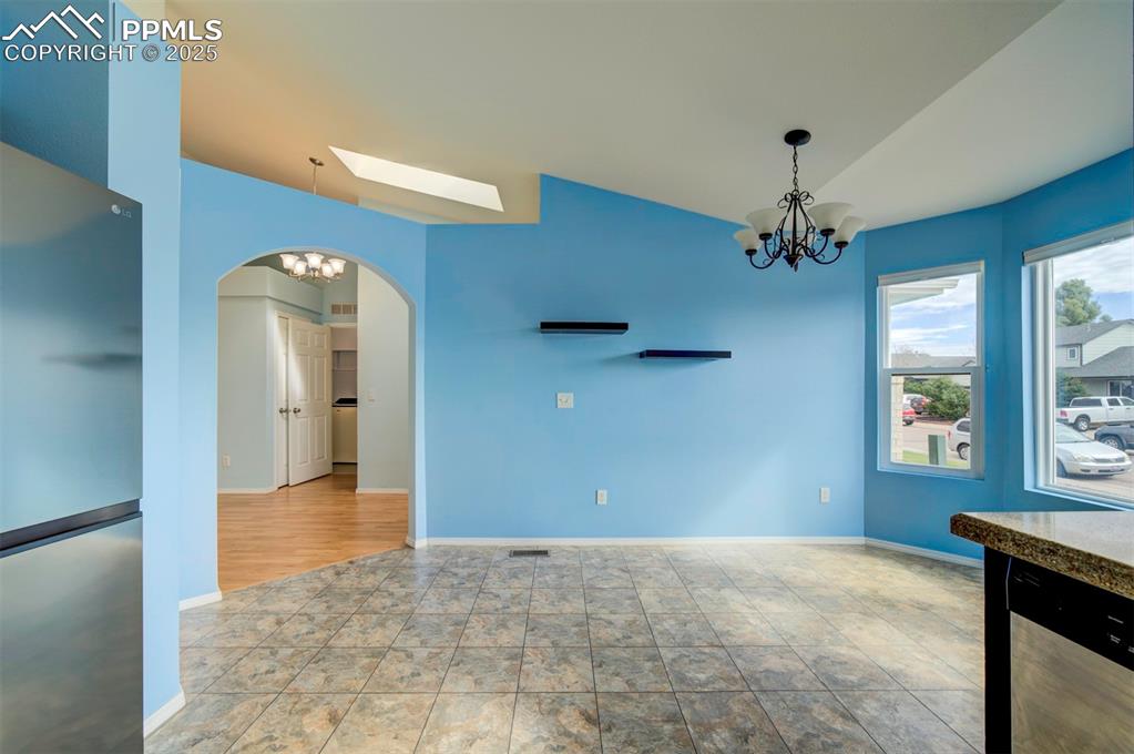 8072 Oliver Road Peyton, CO 80831 - Photo 9 of 30 a view of a livingroom with a chandelier