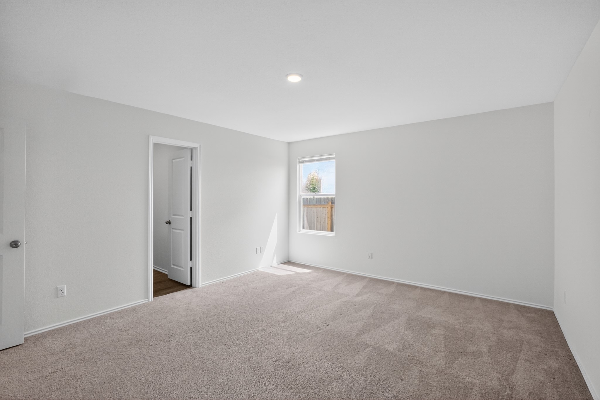 604 Marty Allen Loop Jarrell, TX 76537 - Photo 10 of 15 A spacious, naturally illuminated room featuring plush carpeting and a clear view of the surrounding landscape.