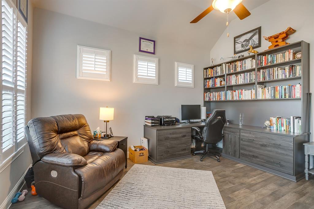 11829 Kynborrow Road Fort Worth, TX 76052 - Photo 20 of 39 a living room with furniture a bookshelf and a window