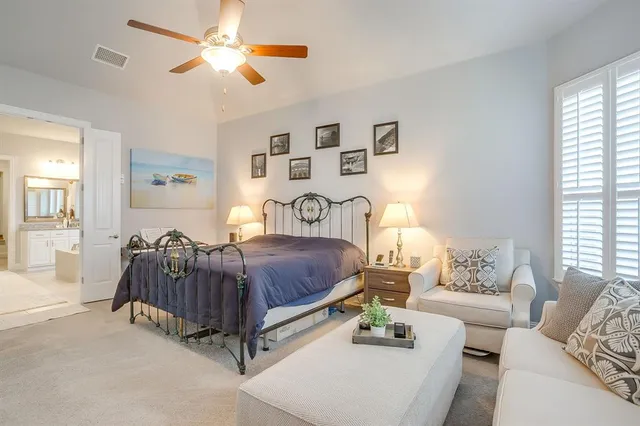 a spacious bathroom with a granite countertop sink mirror and a bathtub