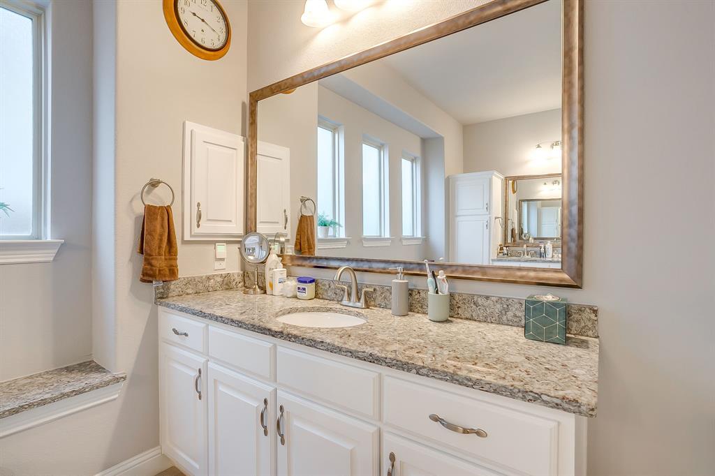 11829 Kynborrow Road Fort Worth, TX 76052 - Photo 31 of 39 a bathroom with a granite countertop sink and a mirror