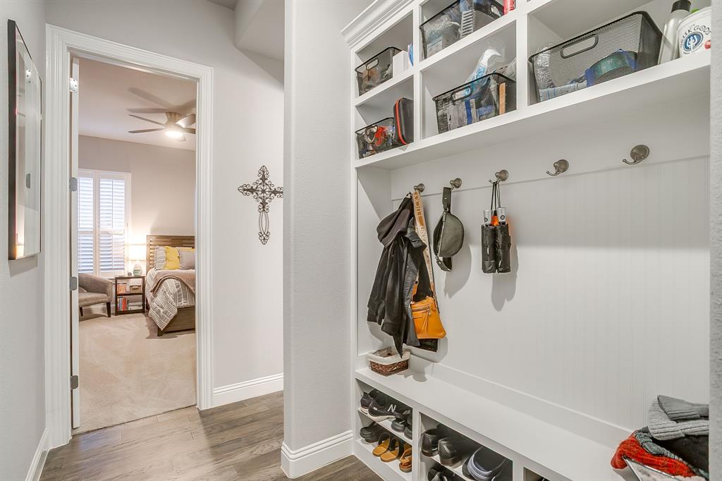 11829 Kynborrow Road Fort Worth, TX 76052 - Photo 32 of 39 a view of walk in closet with clothes and shoes
