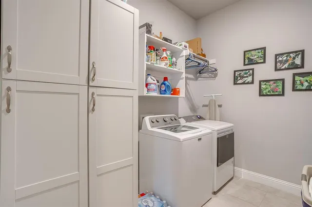 a view of an empty room with a sink and a large window