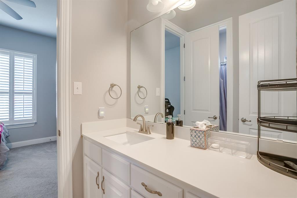 11829 Kynborrow Road Fort Worth, TX 76052 - Photo 34 of 39 a bathroom with a sink and a mirror