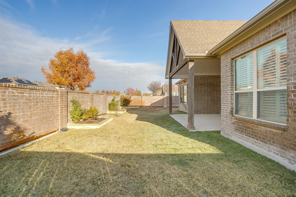 11829 Kynborrow Road Fort Worth, TX 76052 - Photo 38 of 39 a view of a house with backyard and sitting area