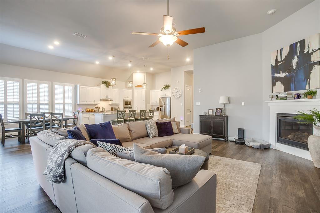 11829 Kynborrow Road Fort Worth, TX 76052 - Photo 4 of 39 a living room with furniture kitchen view and a fireplace
