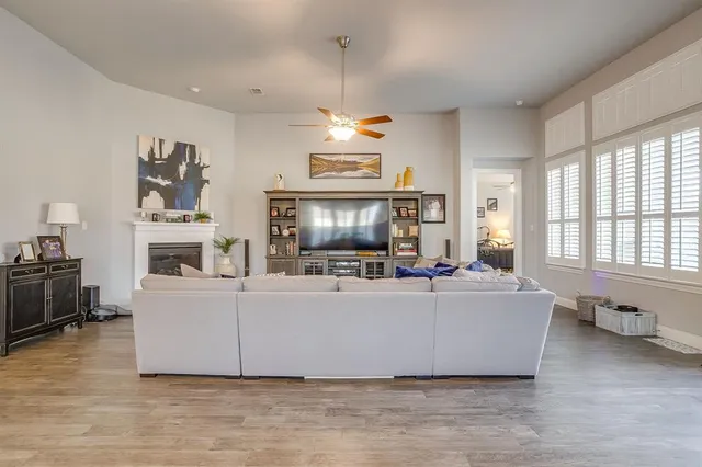 a living room with fireplace furniture and a flat screen tv