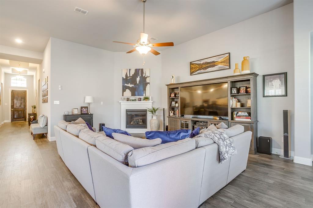 11829 Kynborrow Road Fort Worth, TX 76052 - Photo 6 of 39 a living room with fireplace furniture and a flat screen tv