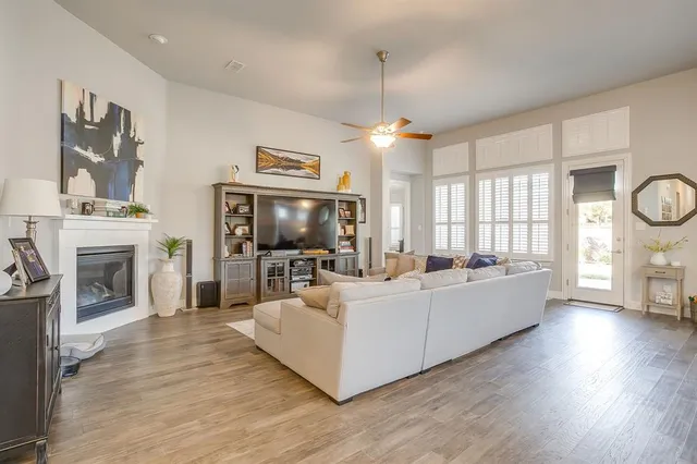 a living room with furniture and flat screen tv